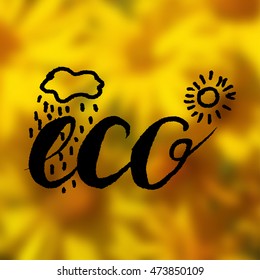 Vector lettering eco made with brush pen with sun and rain on yellow blurred background. Inscription eco.