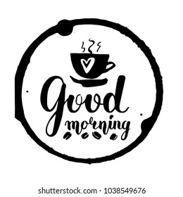 Vector lettering with a good morning. black text and coffee beans white background inside a round imprint of a hot coffee cup. Handwritten calligraphy. sticker