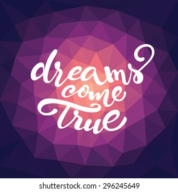Vector lettering of inspirational quote 'Dreams come true' for poster or card design on abstract triangle violet pattern
