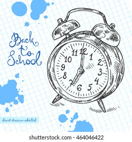 Vector linear illustration of the alarm clock on the textured paper sheet in cell. Hand drawn sketch of the retro clock in vintage style with handwritten text Back To School and ink blots.