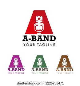vector logo with an acoustic loudspeaker, microphone and the words A band, written around with strong font on white background in four colors - red, violet, green and brown