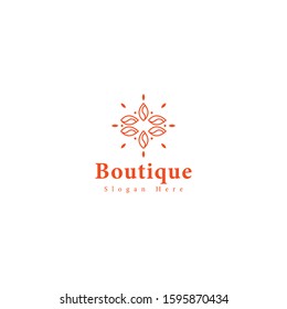 vector logo boutique with leaf shapes in a circle.