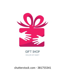 Vector logo design for holidays and gift shop. Hands holding pink gift box with ribbon. Negative space flat icon. 