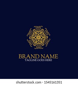 Vector logo design template and emblem with petals and lines - luxury beauty spa concept - golden badge for yoga studios, holistic medicine centers, natural and organic food products and packaging