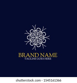 Vector logo design template and emblem with petals and lines - luxury beauty spa concept - golden badge for yoga studios, holistic medicine centers, natural and organic food products and packaging