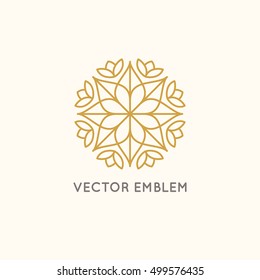 Vector logo design template and emblem made with leaves and flowers - luxury beauty spa concept - badge for yoga studios, holistic medicine centers, natural cosmetics and organic food products 