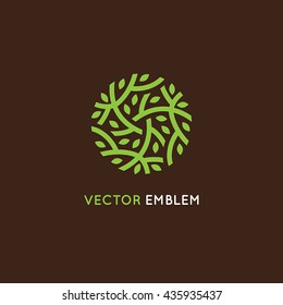 Vector logo design template in green color - abstract sign end emblem for holistic medicine centers, organic food stores, natural cosmetics products - circle made with leaves and branches