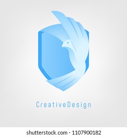 Vector logo design. White bird on the blue shield. White pigeon flies.