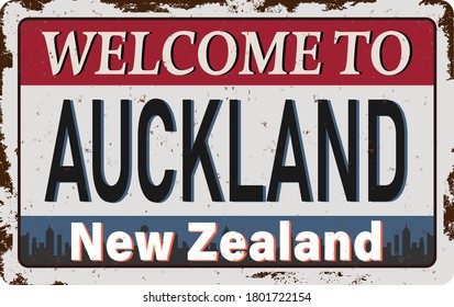 Vector logo enamel Auckland New Zealand, vertical banner rusted sign on background