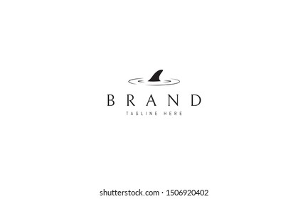 Vector logo on which an abstract image of a shark fin.