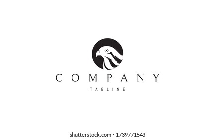 Vector logo on which an abstract image of a hawk head in a circle.
