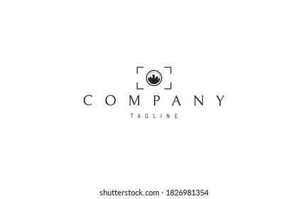 Vector logo on which the abstract image of the city silhouette in the frame of the lens.