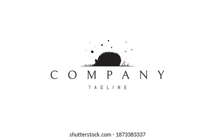 Vector logo on which an abstract image of a silhouette of a hedgehog in the grass against the background of flying butterflies.