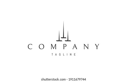 Logo vectorial en el que una imagen abstracta de tres picos en forma de edificios altos.