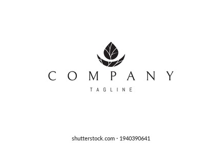 Vector logo on which an abstract image of a drop and a moon with a silhouette of a tree.