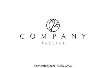 Vector logo on which an abstract image of the moon and a tree in a circle.