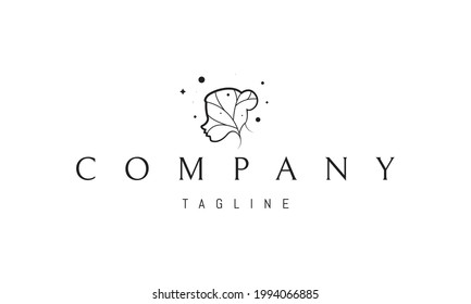 Logo vectorial en el que una imagen abstracta de la silueta de una cabeza femenina con un árbol.