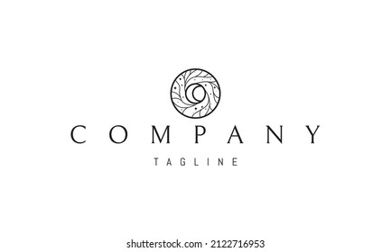 Vector logo on which an abstract image of the moon in the center of a swirl of trees.