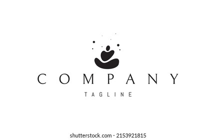 Vector logo on which an abstract image of pebbles in the form of a meditator.