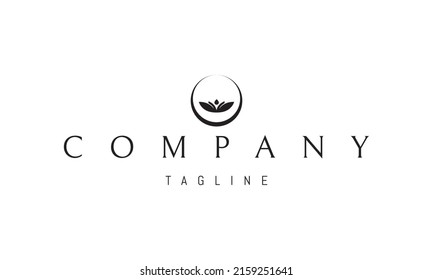 Vector logo on which an abstract image of a bowl in the form of a moon with leaves and a drop inside.