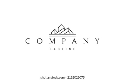 Vector logo on which an abstract image of modern houses in the form of mountains.