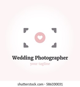Vector logo template for wedding photographer. Illustration of camera with a heart in the lens in minimalistic style. Cute logotype for a girl-photographer. EPS10.