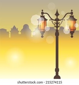 Vector magical evening city in a yellow-brown tones with a luminous street lantern