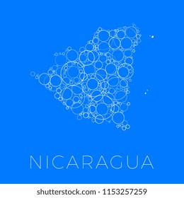 vector map of nicaragua filled with white circles of different sizes and degrees of transparency on blue background