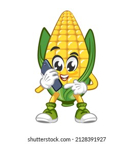 Mascota vectora, dibujos animados y una linda ilustración de maíz sosteniendo un teléfono celular