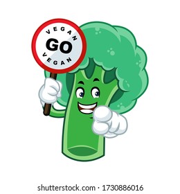 Vector mascot, cartoon, and illustration of a broccoli holding go vegan sign board
