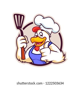 Vector mascot, cartoon, and illustration of a chicken chef holding sepatula badge version.