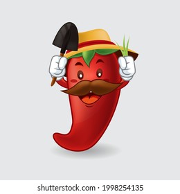 Vector mascot, cartoon, and illustration of a chili holding scop and grass