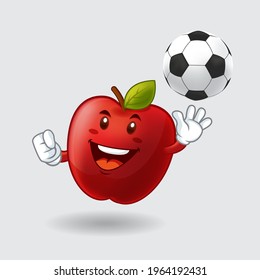 Vector mascot, cartoon, and illustration of a red apple playing soccer