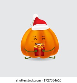 Vector mascot illustration_cute pumpkin with red cap receiving a Christmas gift box happily_in isolated background