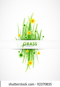 Vector meadow template. Green grass and color flowers background with sample text