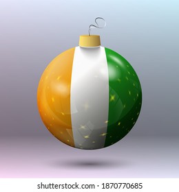 Vector - Merry Christmas ball with Ivory Coast flag