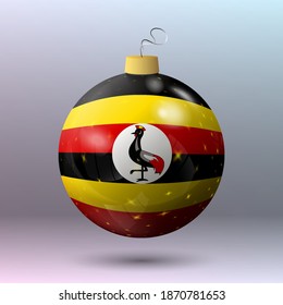 Vector - Merry Christmas ball with Uganda flag