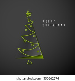 Vector Tarjeta navideña Merry con un oscuro árbol minimalista hecho de papel