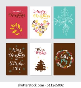 Vector Merry Christmas greeting cards and invitations isolated on background. Set with lettering, Xmas tree, mistletoe and wreath hand drawn designs. Vector elements for Xmas design.