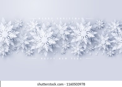 Vector Merry Christmas and Happy New Year background with realistic looking paper cut snowflakes. Seasonal Christmas and New Year holidays greeting card