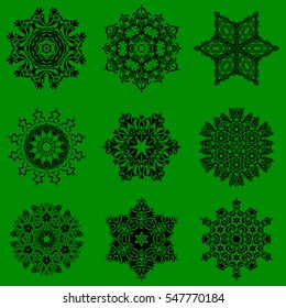 Vector Merry Christmas and Happy New Year lettering quote. 9 snowflakes set on a green background. Hand drawn design with abstract winter doodles.