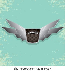 Vector metallic automotive, motorcycle badge with wings. Signs and labels.