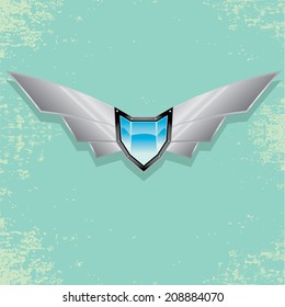 Vector metallic automotive, motorcycle badge with wings. Signs and labels.
