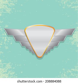 Vector metallic automotive, motorcycle badge with wings. Signs and labels.
