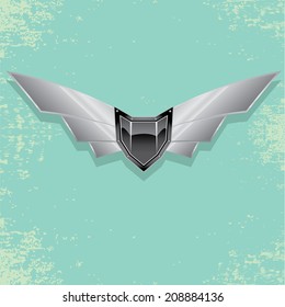 Vector metallic automotive, motorcycle badge with wings. Signs and labels.