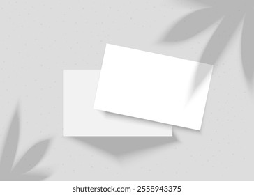 Vector mockup of business cards with plant shadow. Two business cards on a gray background