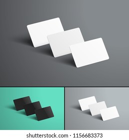 Vector Mockup  of three gift or bank cards with shadows standing with a row one after another. A realistic template of black and white on colored backgrounds. Set