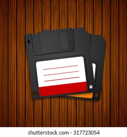 Vector modern diskette on wooden background. Eps10