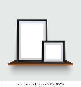 Vector modern two empty frames standing on a wooden shelf