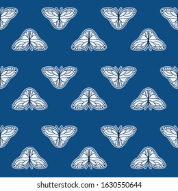Vector Monarch Butterflies in Classic Blue Color seamless pattern background.